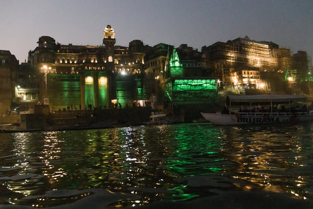 green city lights reflecting on water