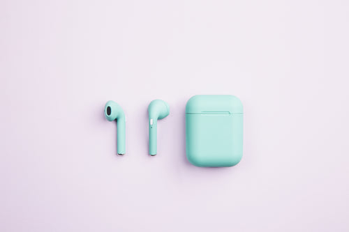 green earbuds and case