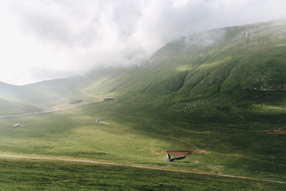 green hills lead to the sky