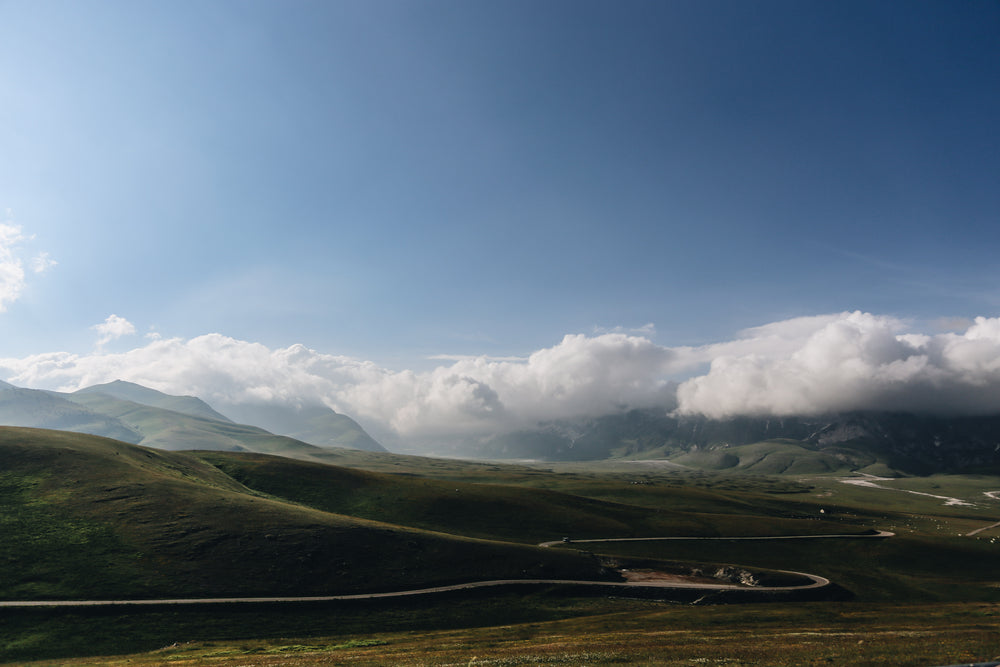 green landscape with low clouds