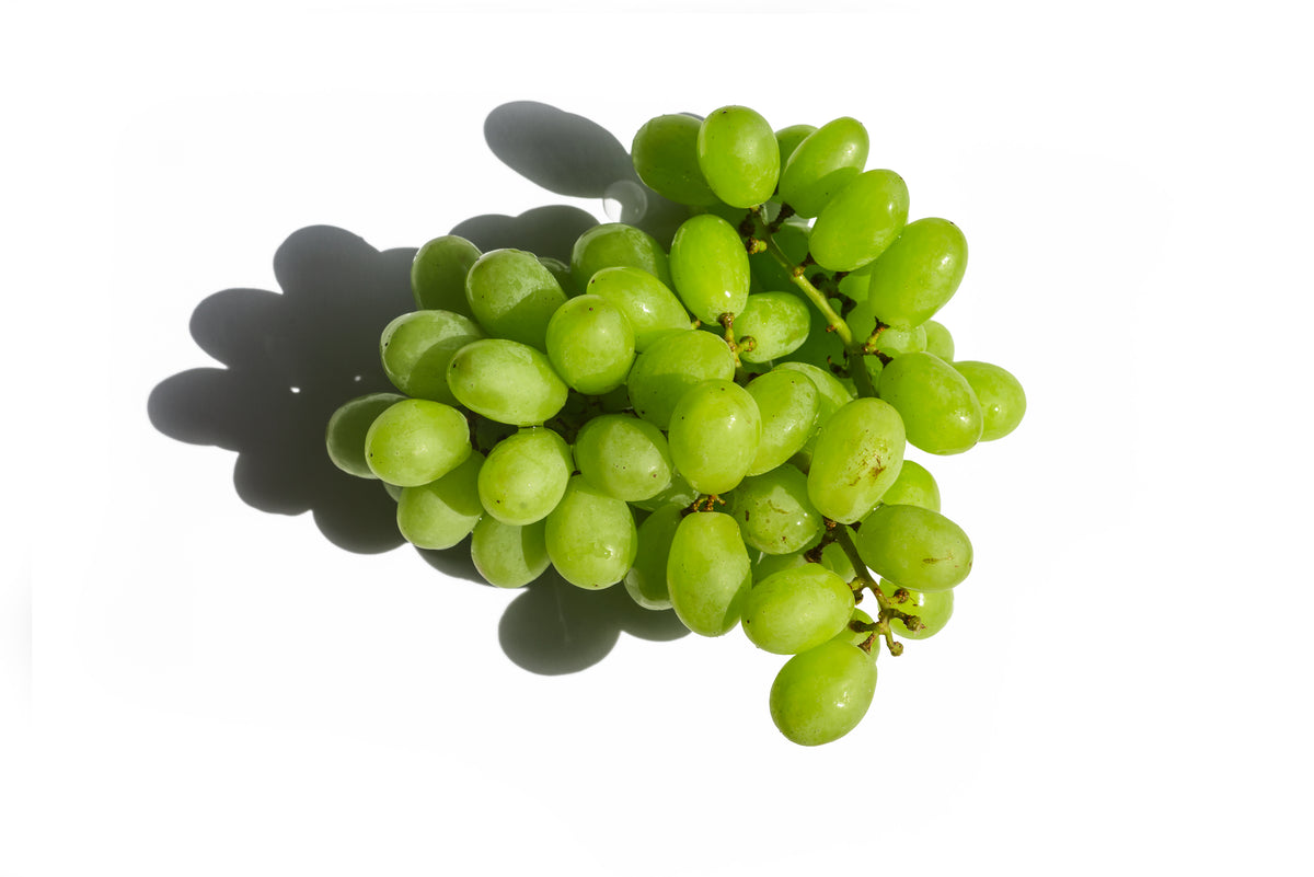 green table grapes on a white background