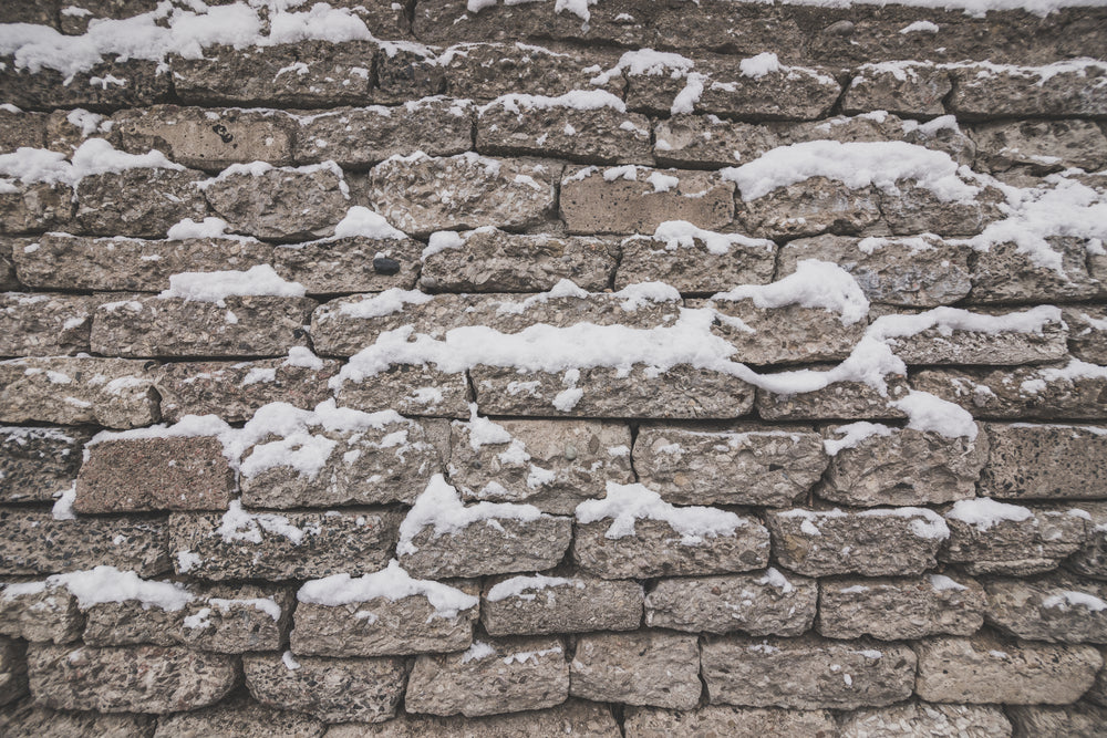 grey brick with snow