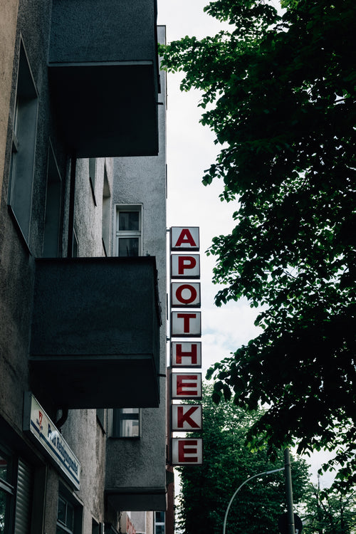 grey building with the word apotheke along the side