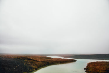 grey sky over fall field