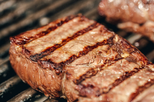 grill marked steak on bbq
