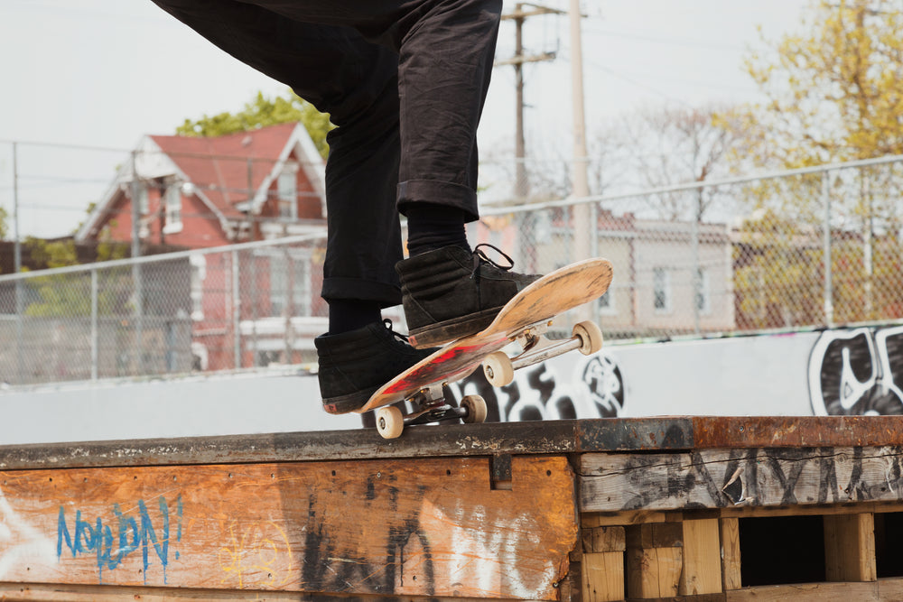 grinding a ledge with a skateboard