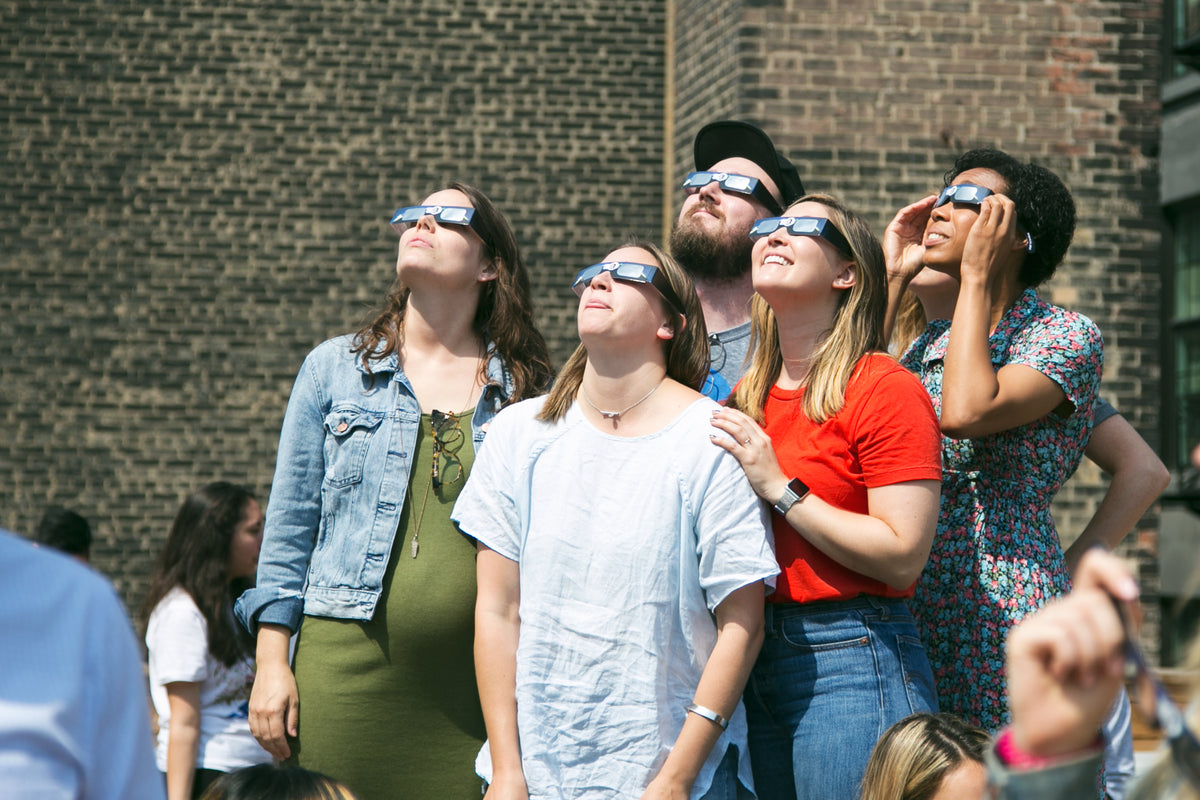 group watches eclipse