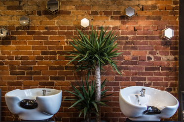 hair salon sinks on red brick