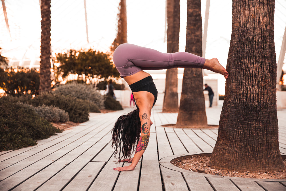 half a handstand against a tree