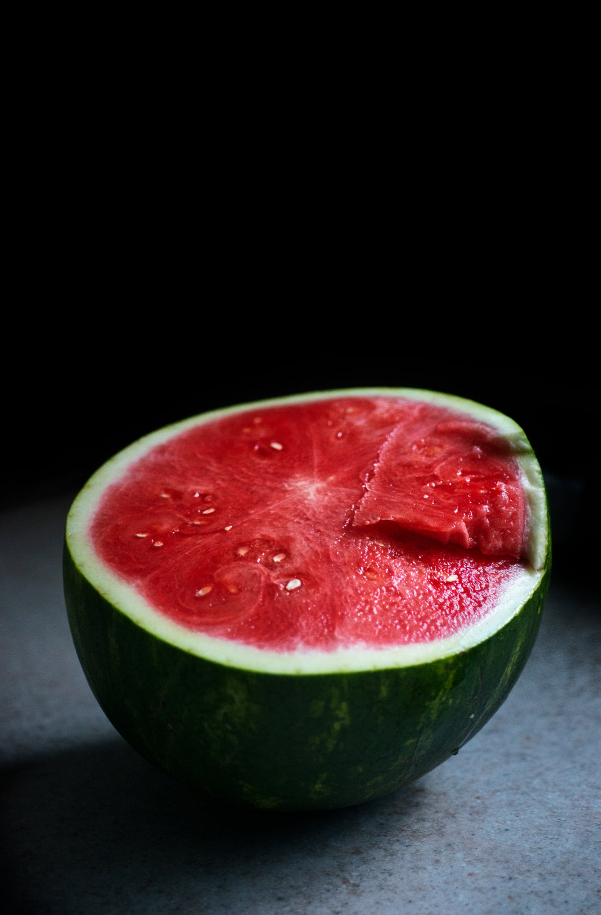 half of a perfect ripe watermelon on a countertop