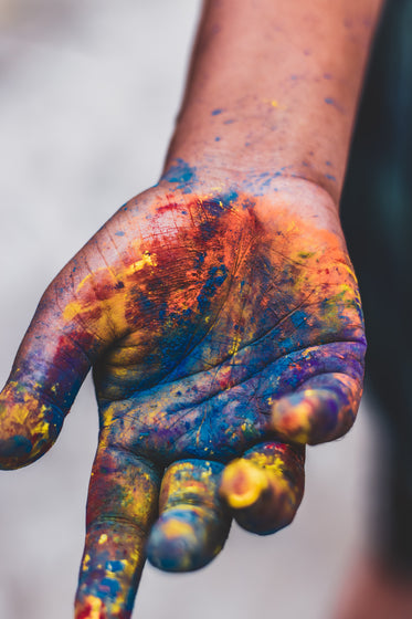 hand covered in powdered paint