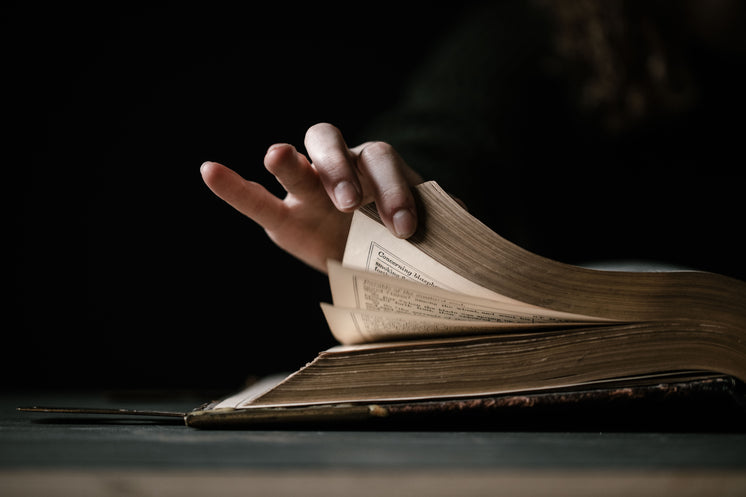 Hand Flips The Pages Of Book