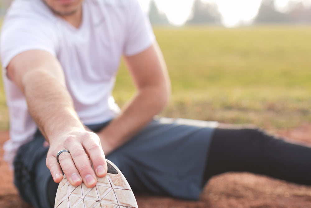 hand grabs toes for stretch