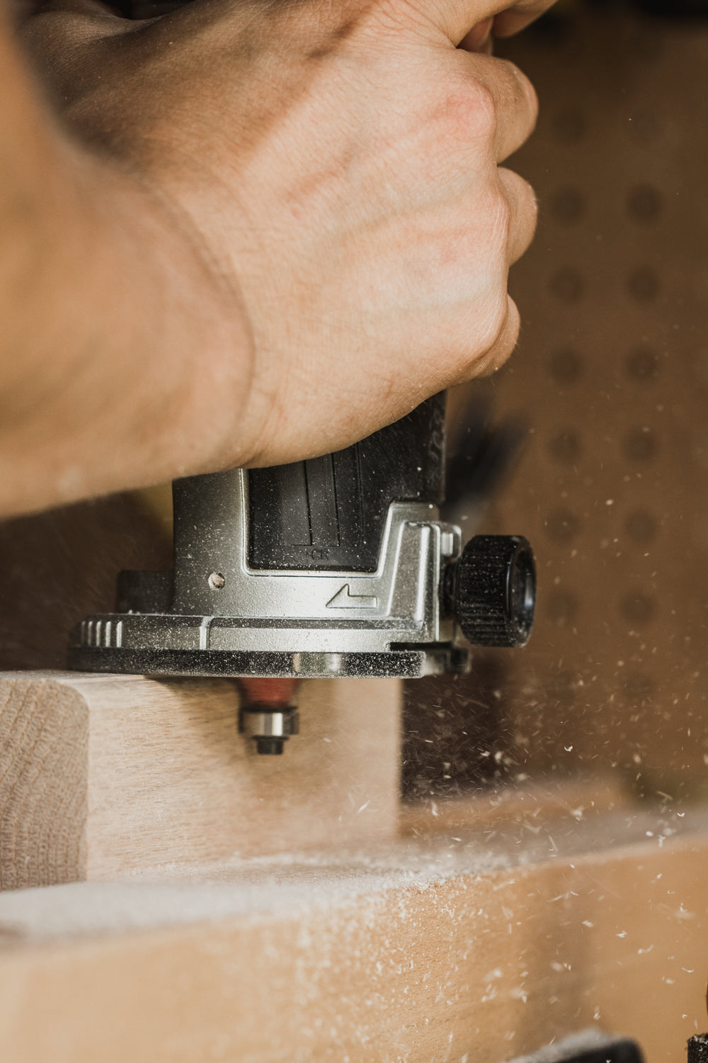 hand-held router shaping wood