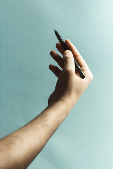 hand holding a pen photo