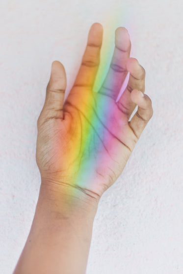 hand holding a rainbow