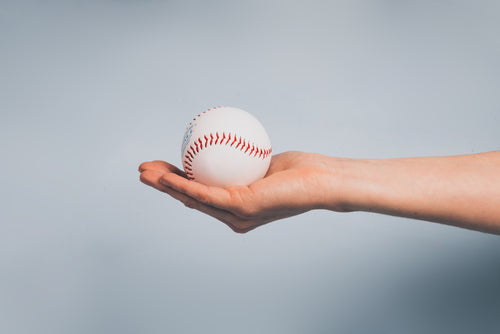 hand holding baseball