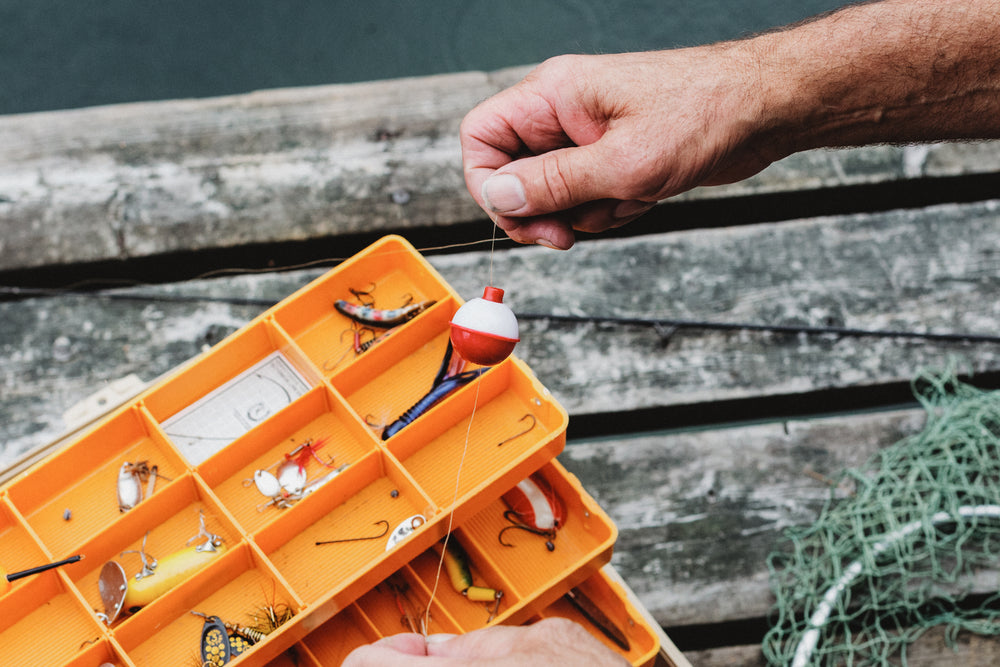 hand holding fishing bobber