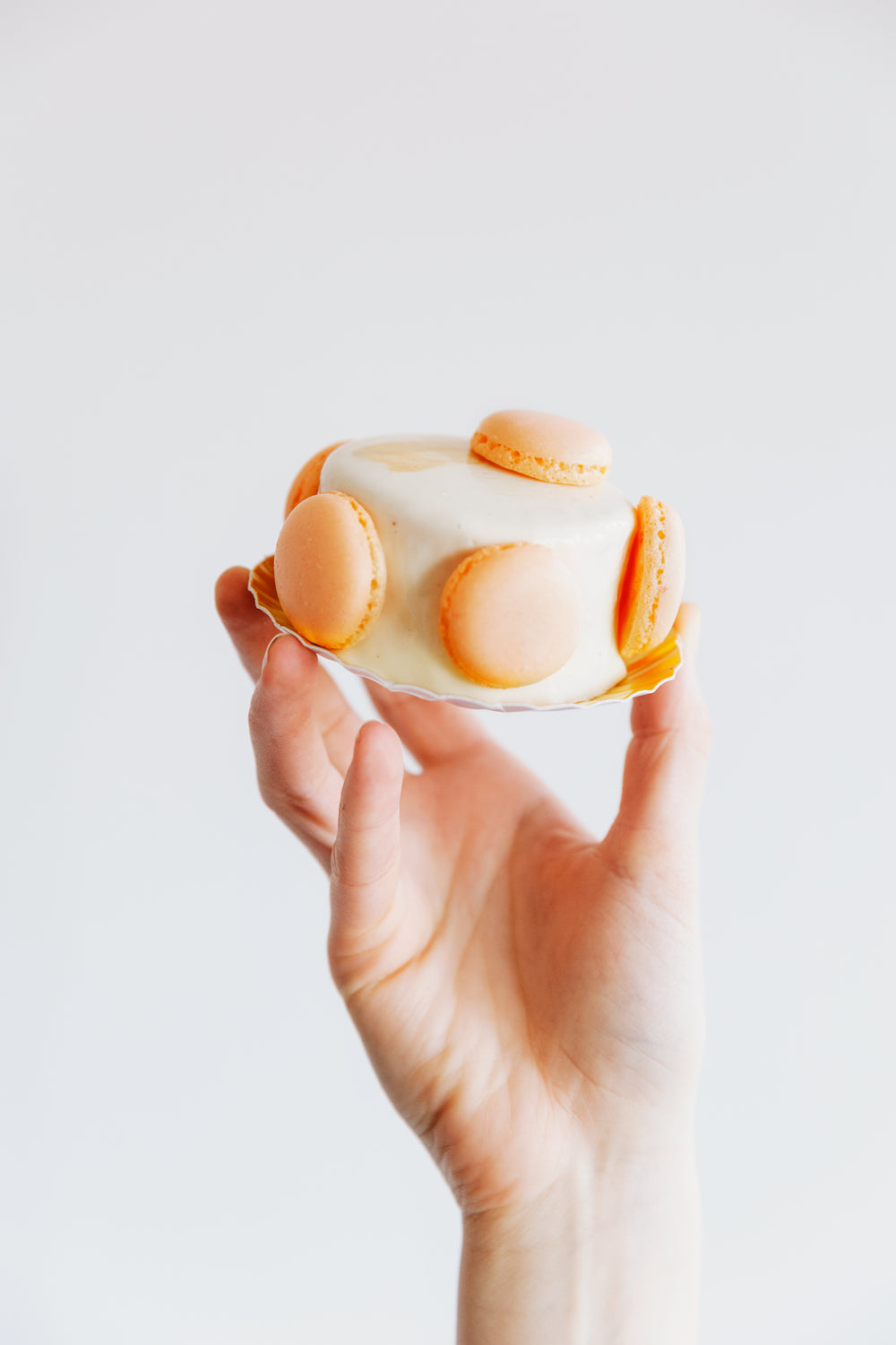 hand holding small cake