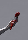hand holding up red paint brush