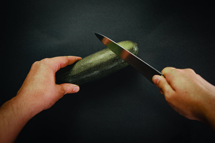 hand-holds-a-knife-ready-to-chop-a-zucchini.jpg?width=746&format=pjpg&exif=0&iptc=0