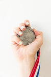 hand holds medal