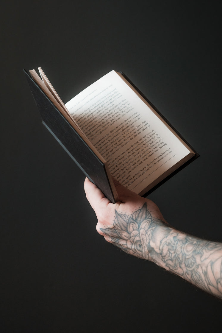 hand-holds-out-an-open-book.jpg?width=74