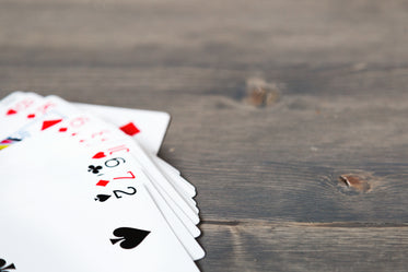 hand of cards on wood