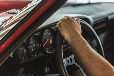 hand on steering wheel