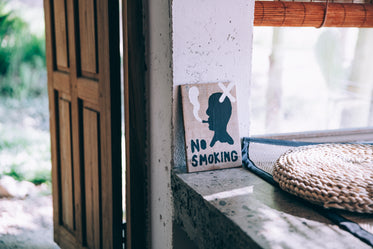 hand-painted no smoking sign