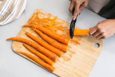 hand peeling carrots