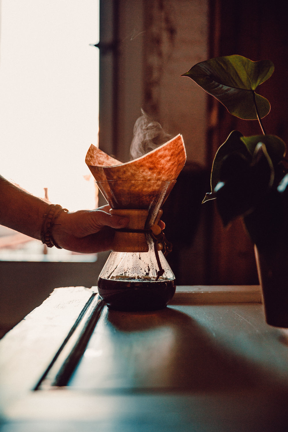 hand reaching for fresh coffee