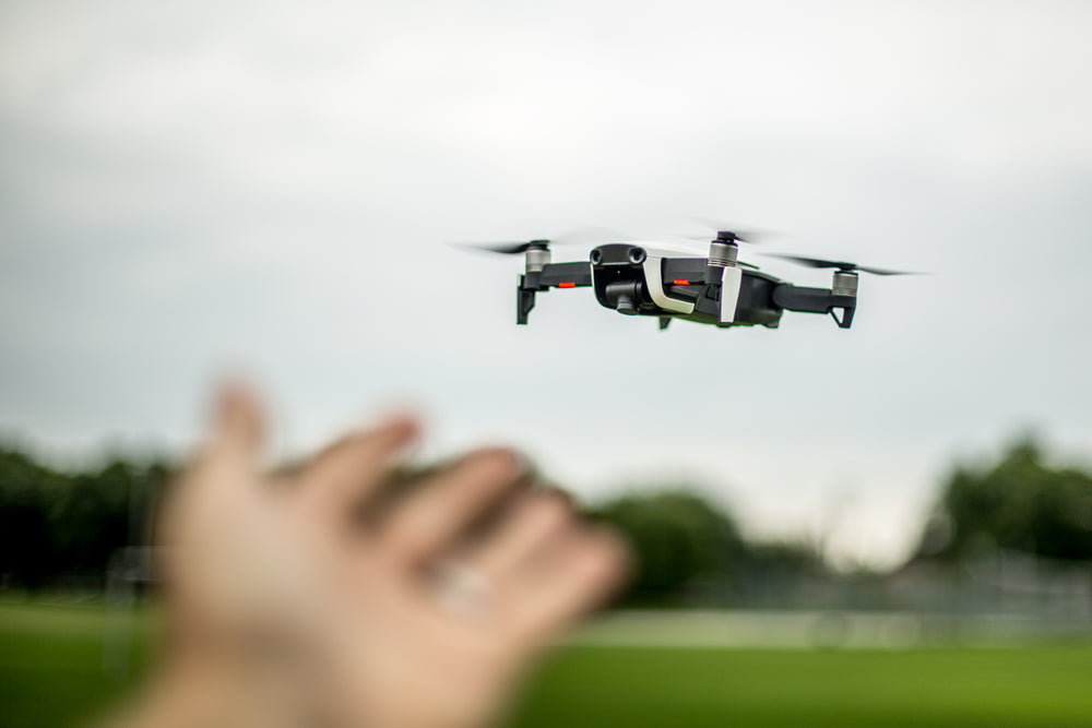 hand reaching out to drone