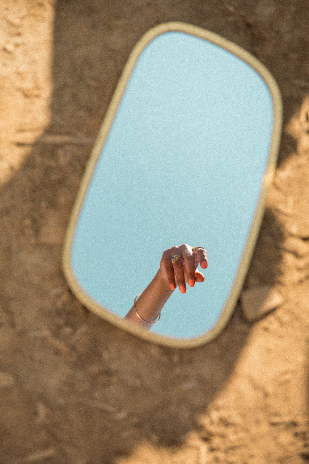 hand reflected in a mirror