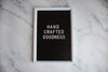 handcrafted goodness sign on marble