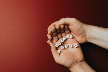 hands cup wooden blocks spelling the words mental health