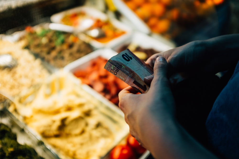 hands hold ten euro note