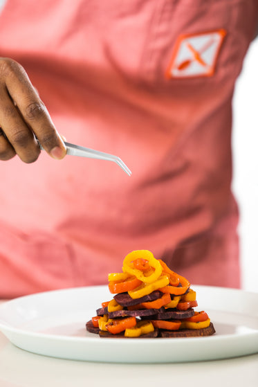 hands holds tongs going in for a bite