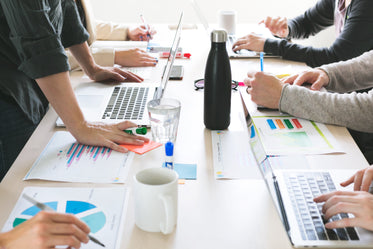Picture of Hands On Desk At Meeting — Free Stock Photo