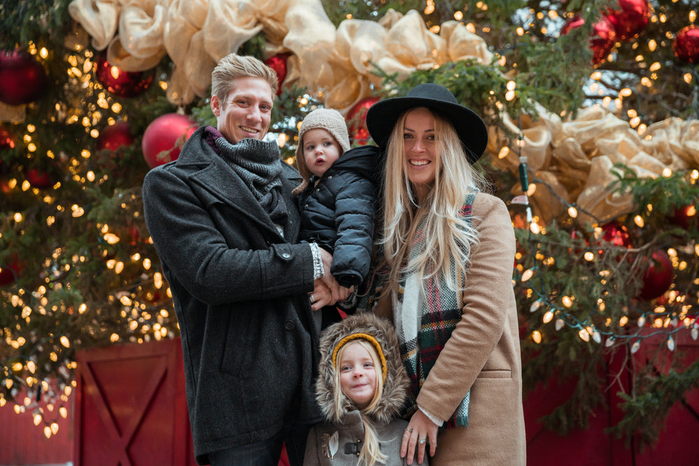 happy family in front of christmas tree