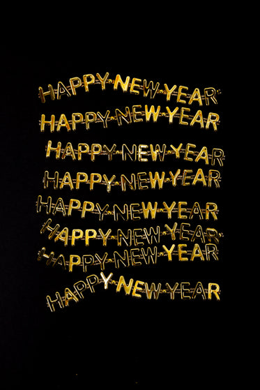 happy new year repeated in gold