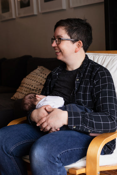 happy woman feeds child