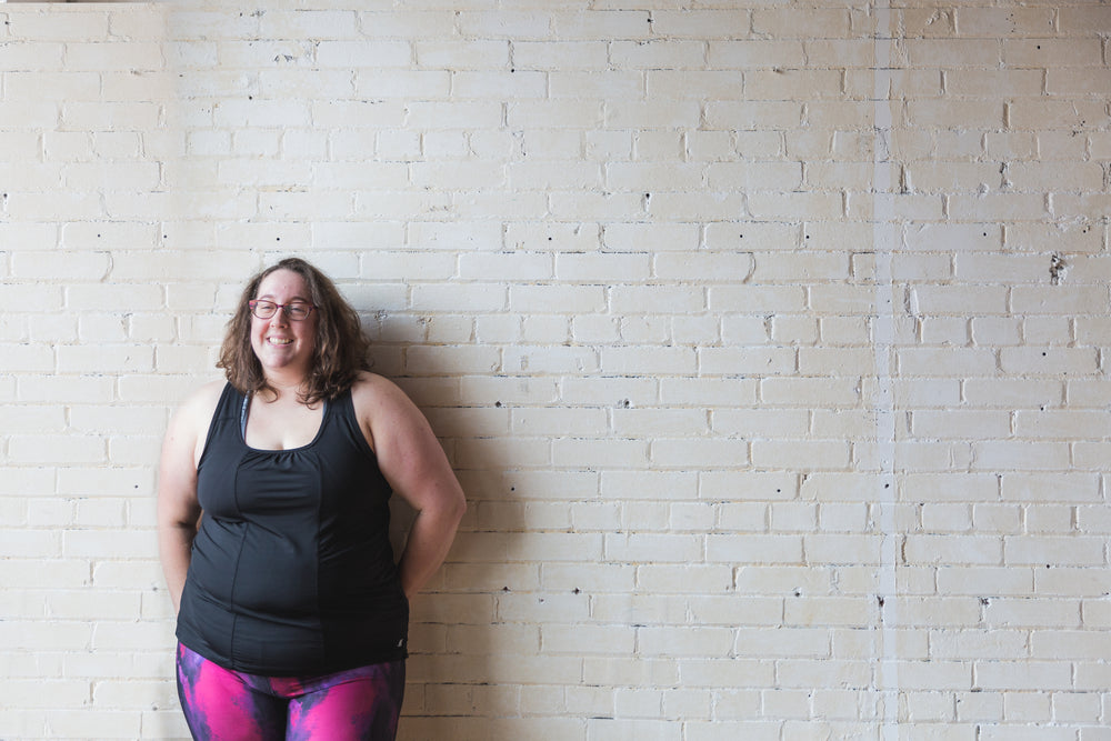 happy woman in fitness clothes