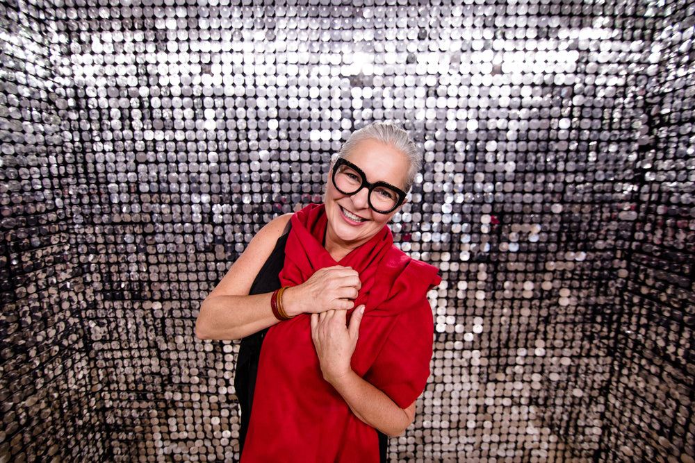 happy woman in silver shiny room