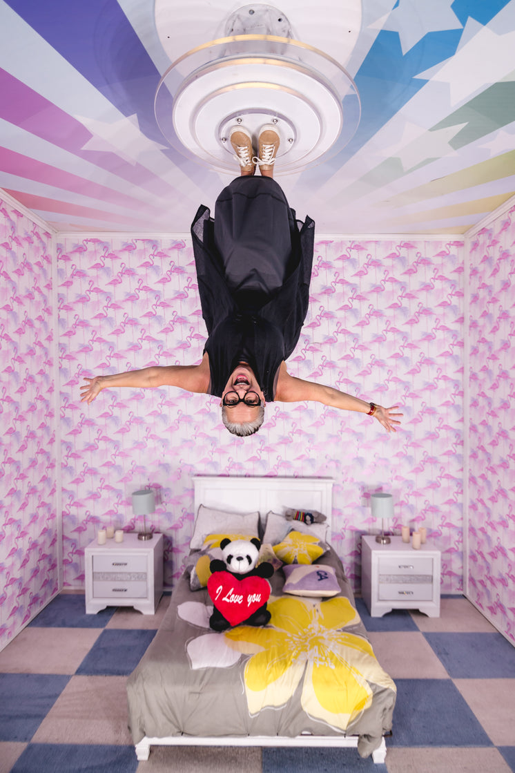 Happy woman In upside Down Playroom