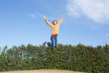 happy woman jumps on trampoline