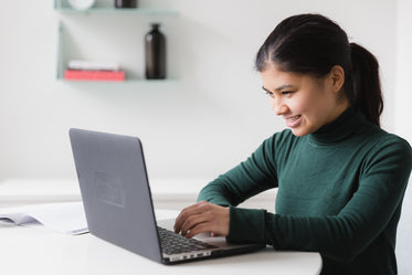 happy woman on computer