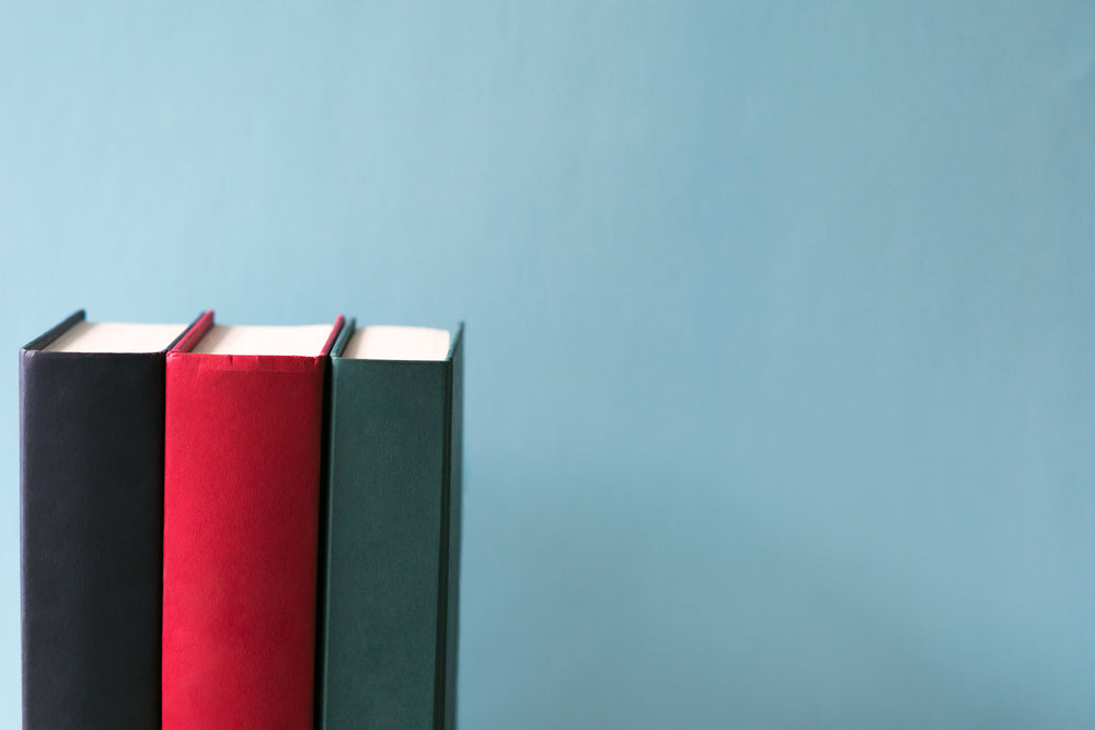 hard cover books on blue background