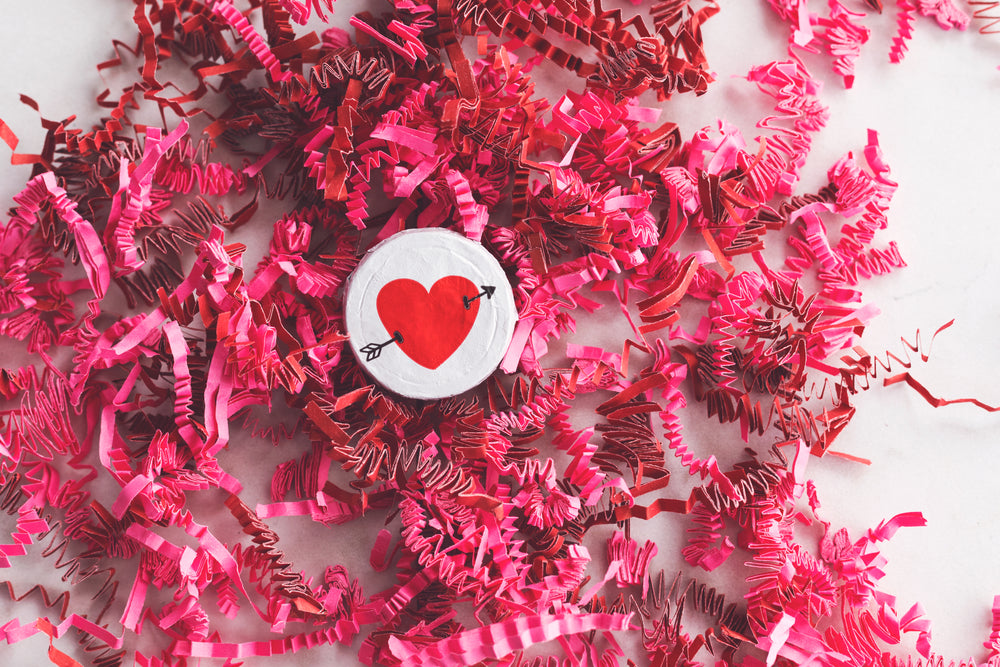 heart candy on top of pink decorations