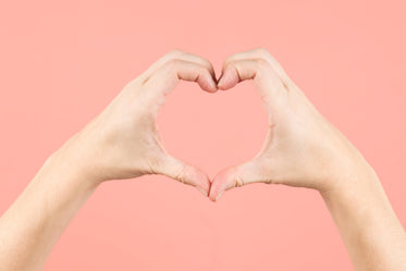 heart hands on pink